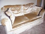 We have a pair of these sofas - color looks weird in photo, but they are very nice in person.