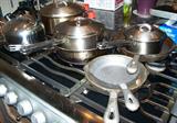 Cookware, including a few cast iron skillets.