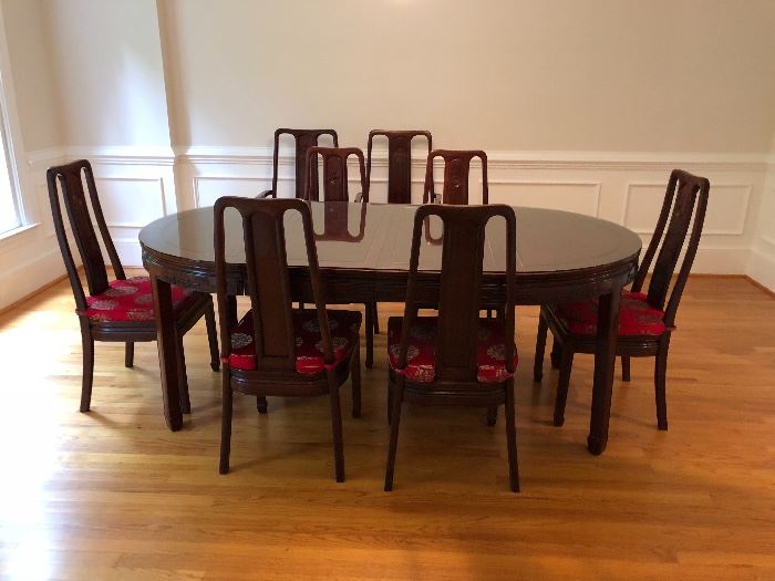 Gorgeous Rosewood dining room table purchased in China. Measures 44” across and 44” long with no leaves. Photo shows table with 2 18” leaves in. 8 chairs- 2 captain, 6 side chairs. 