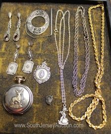 Tray Lot of STERLING Jewelry Including 3 Necklaces, Pocket Watch, 2 Pairs of Earrings, Pendant and More
Located Inside – Auction Estimate $50-$100

