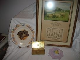 1921 calendar plate, cigarette case, a framed 1921 calendar and a Royal Doulton floral piece