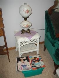 Wicker stand, lamp and magazines