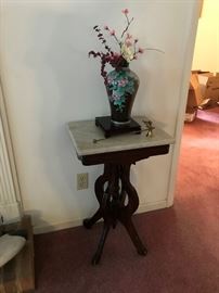 Orenital vase and antique marble top table