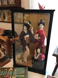 Beautiful orenital dolls in glass case and vintage box of valentine cards 
