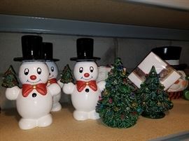 Sets of lighted Christmas trees, napkin holders, Snowmen holding Trees, etc. Extensive Choices...shelves full of wonderful Holiday ceramics