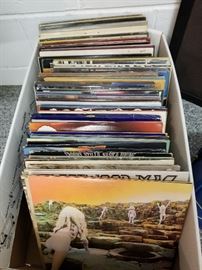 Hundreds of albums span the 60's thru the 90's, found on each level of house.