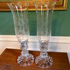 Baccarat crystal candle holders with etched shades.