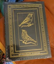 Several new Easton press classic novels still sealed in cellophane.