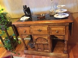 Bar/Buffet Cabinet (with inlaid marble top, on casters), Pair of Ceramic MCM Style Black Statue of Couple, Serving Pieces and Decanter.