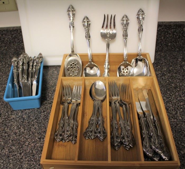 Flatware- 53 Piece Set, 18-10 Stainless Steel, Oneida “Michelangelo”, w/ serving tools & butter knives.
    -8 place settings

