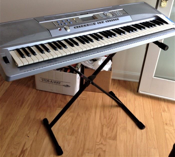 Electronic Keyboard w/ Stand:  Yamaha DGX-202 “Portable Grand”    
Great Keyboard, 46” long, w/ music stand, foot pedal, cords, MIDI cable (#UX16) & folding stand.
