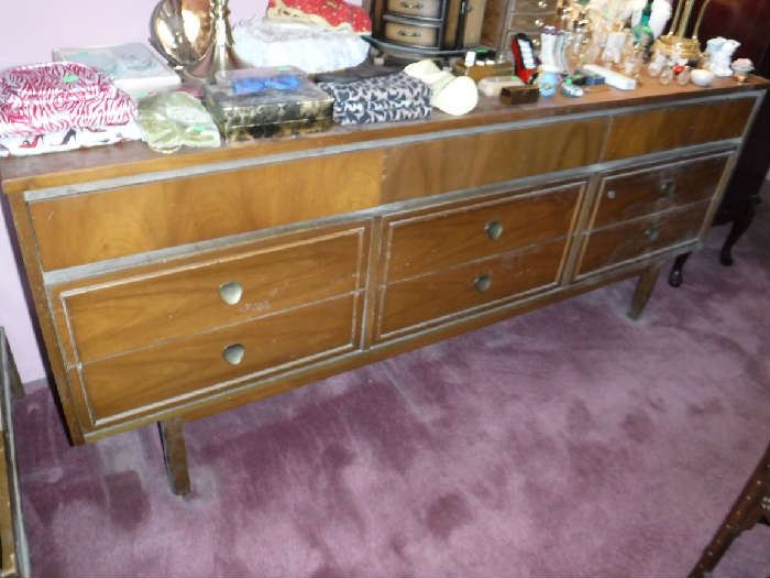 What a grand bureau! Made by the DIXIE Furniture Company It has one mirror on the right side and I see no evidence of their every being a second one