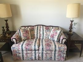 Traditional love seat with floral pattern