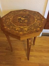 Sweet wood inlaid octagon table is a music box, winder on back, 