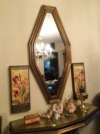 Wall mirror over console table to lighten and expand a room