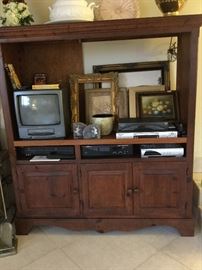 Media cabinet built for large tv, three device slots, lower storage, very nice