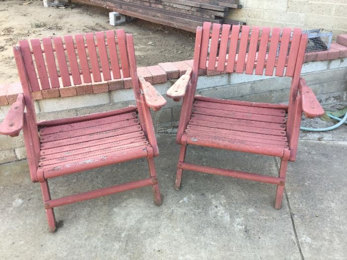 Pair folding red wood chairs, also a table that goes between