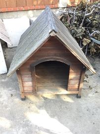 Wood dog house measures approx. 3.25 feet deep, 3 feet wide, 3 feet tall