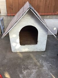 Dog House with shingled roof, approx 4.25  feet deep by 3.75 feet wide by 3/4 of me tall, ? Maybe 3.5 tall