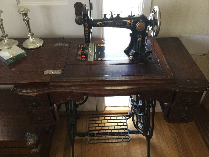 Treadle sewing machine with complete super detailed case, this one a Melville model