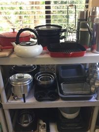 Stacks of new Cuisinart pans, pots, etc.