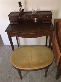 Such a sweet & charming desk! Ad an updated cushion and you'll have an amazingly custom piece!