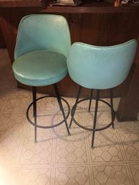 OMG- love the color of these 5 turquoise bar stools.