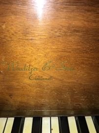Wurlitzer & Sons baby grand piano.