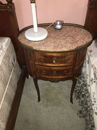 This sweet oval side table has a gorgeous marble top!