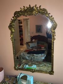 Another fine example of a beautiful gold gilded mirror.