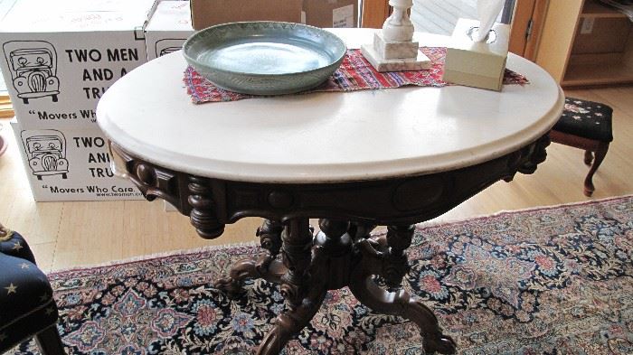 Nice oval walnut marble top table. Rug will not be for sale.