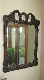 Carved frame mirror.