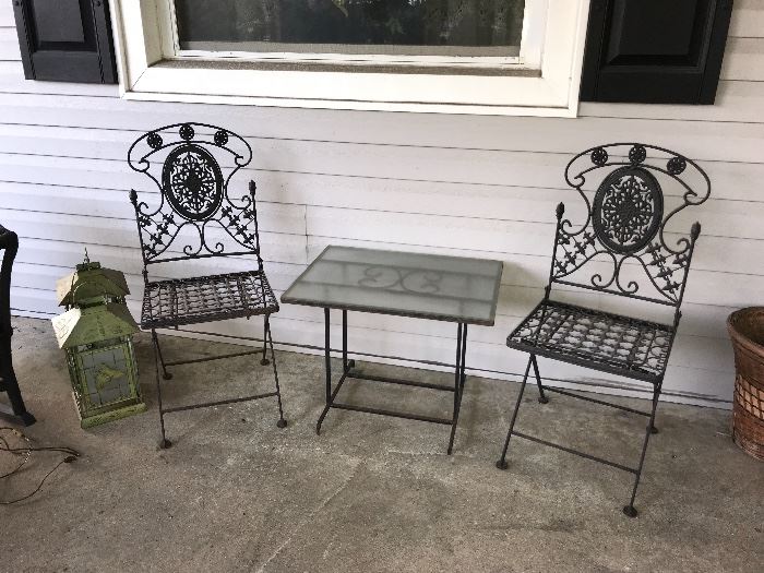 Ornate pair of wrought iron chairs 