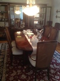 Large solid wood, made in the USA, table with two leaves and 10 chairs.  Great shape