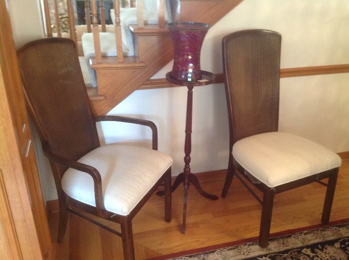Chairs with plant stand and red candle holder