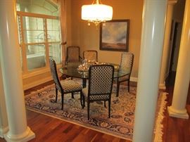 Glass dining table with custom chairs
