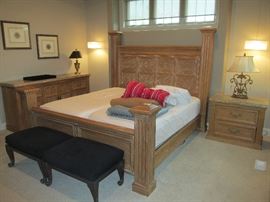 Stone topped nightstand and dresser with king bed