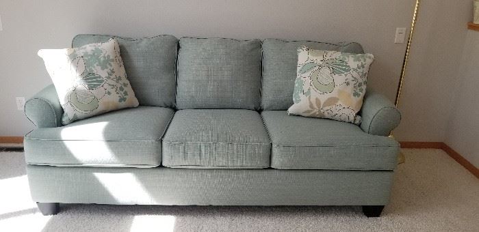 Gorgeous Upholstered sofa in like new condition. Purchased at Ashley Furniture  in 2014.  Treated with five year fabric protection. 