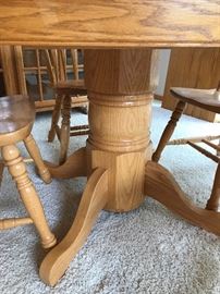 Solid 48” Oak Pedastool table and six chairs (chair seat extra deep and table comes with one 24” extension. 