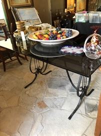 Iron Lyre and smoked glass table, art candle holders, cane bottom chairs 3 (gold rimmed glasses are sold) 