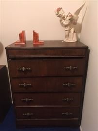 •	Vintage chest of draws, orange marble book ends