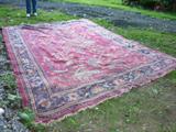 One of several old hand made rugs