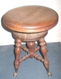 Organ stool with claw and ball feet.