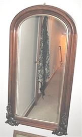 Arch top mirror with decoration and gilt liner. Walnut. About 42" tall.