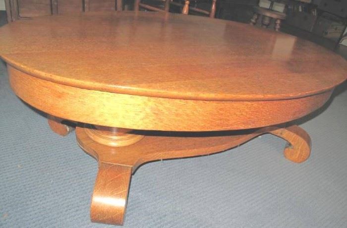 Double pedestal oval oak parlor table now at coffee table height.
