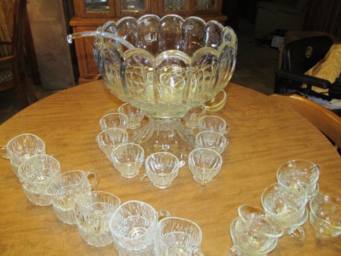 antique munch bowl' heavy glass with 10 cups and glass ladle; also we have an extra glass ladle and extra cups