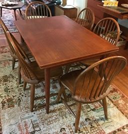 Teak dining room table with pull out end leaves