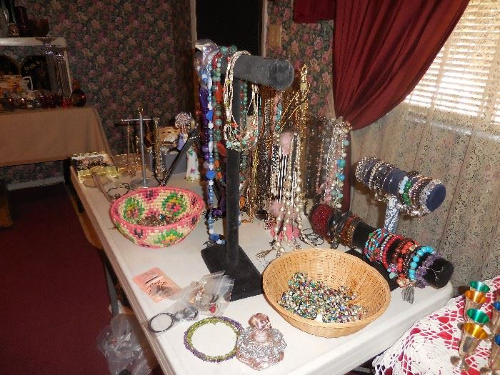Table of jewelry, beaded and some other.  All sterling and better jewelry is in a display case.