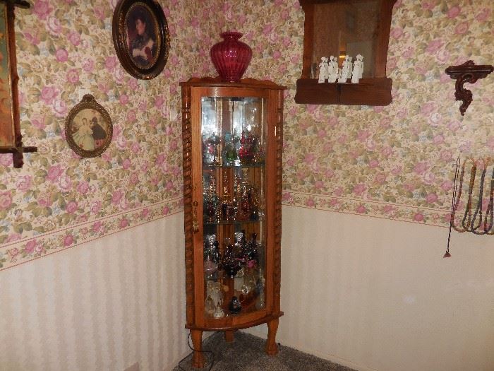 Corner Cabinet with perfume bottles