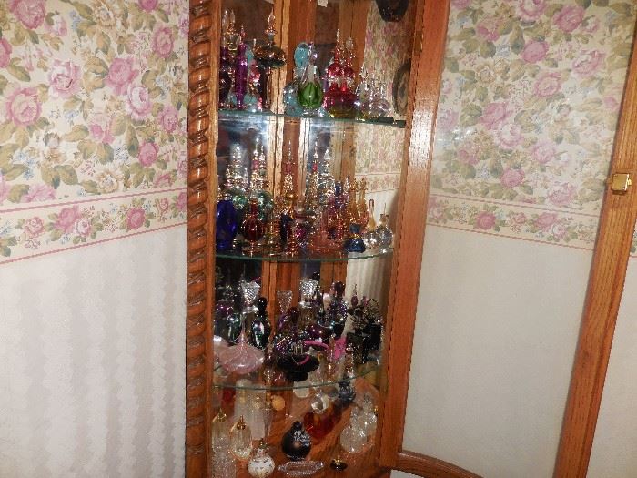Closer look at the perfume bottles .  Cabinet is full,
